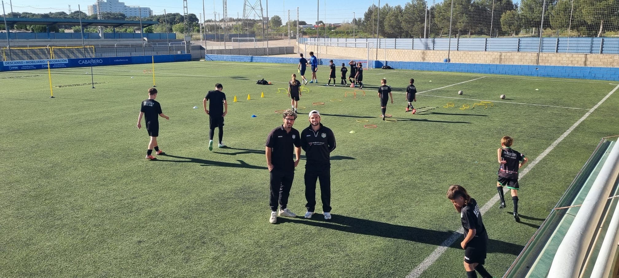 Mastery Football Academy coaches and players training on Spanish pitch during Valencia tour