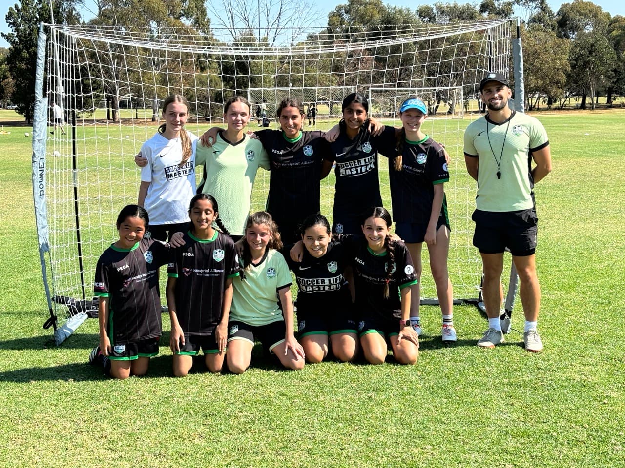Video analysis for professional football coaching classes – Mastery Football Academy coach reviewing youth player footage in Adelaide